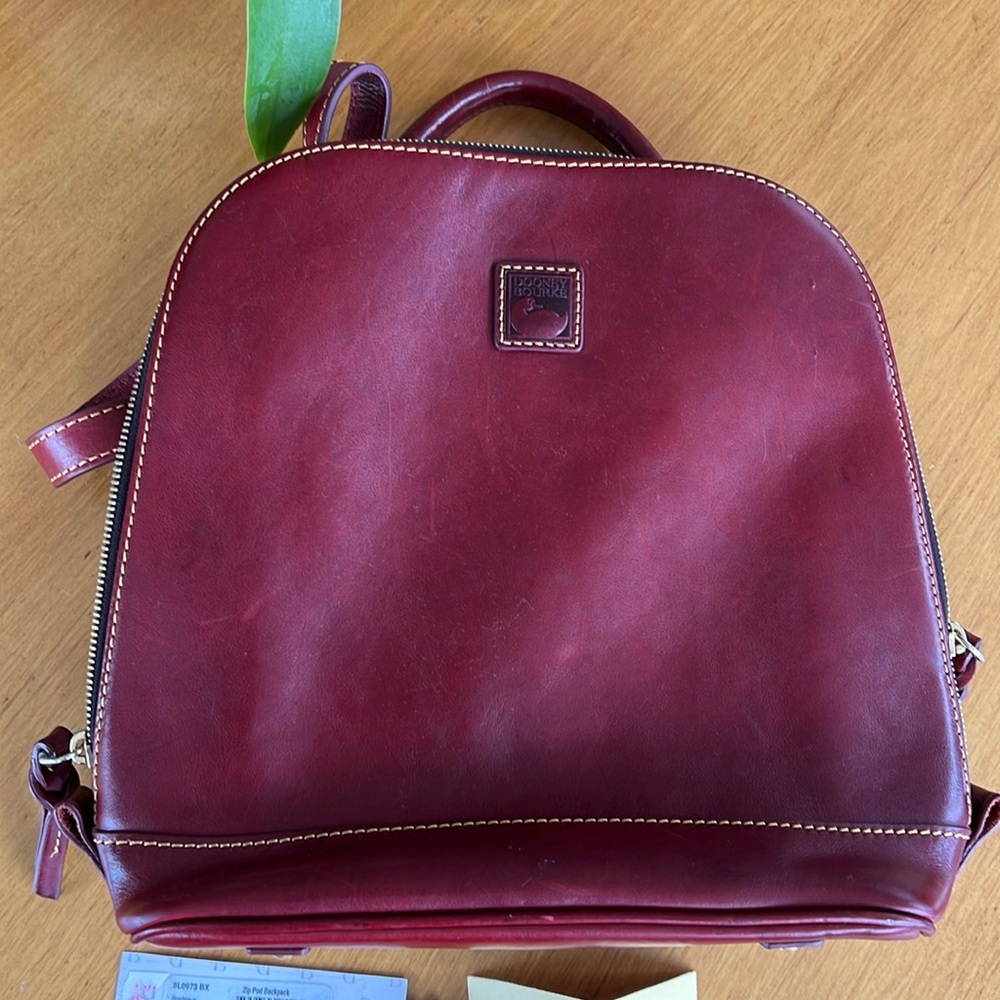 Dooney & Bourke  Zip Pod Backpack In Bordeaux! Gently used with tags & dust bag.